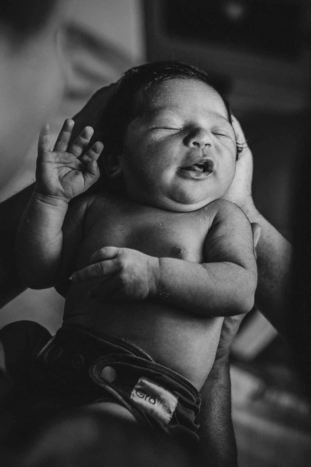 Newborn stretching, in black and white