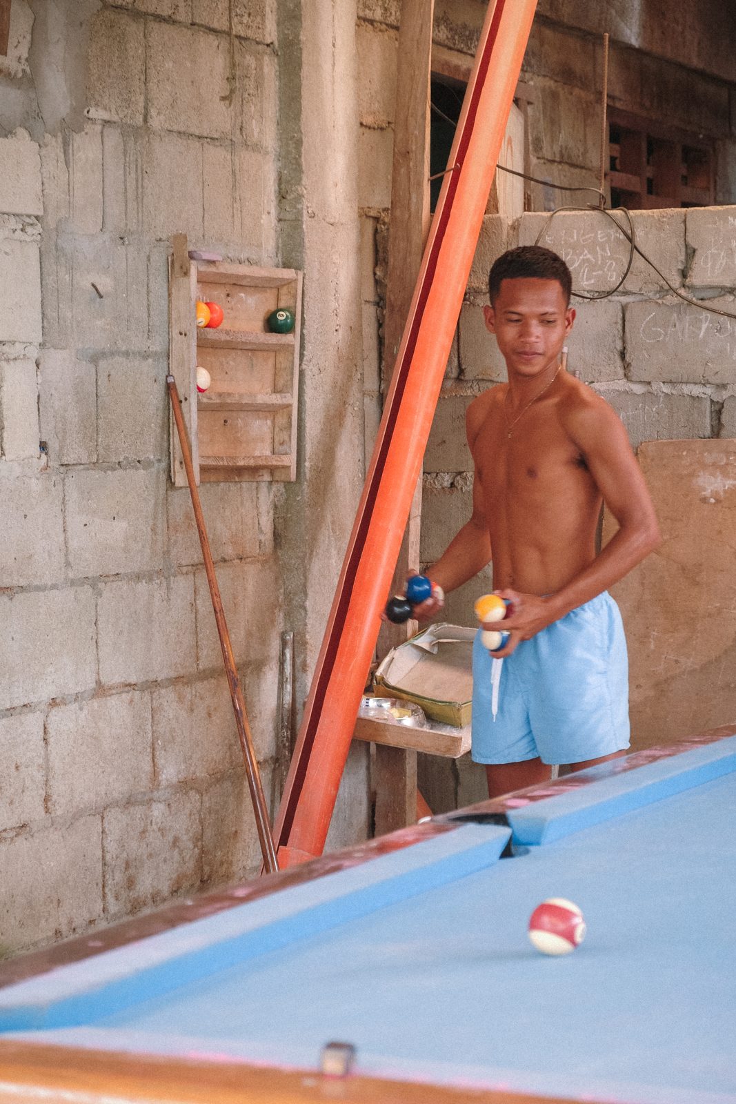 Boy leaning over a pool table